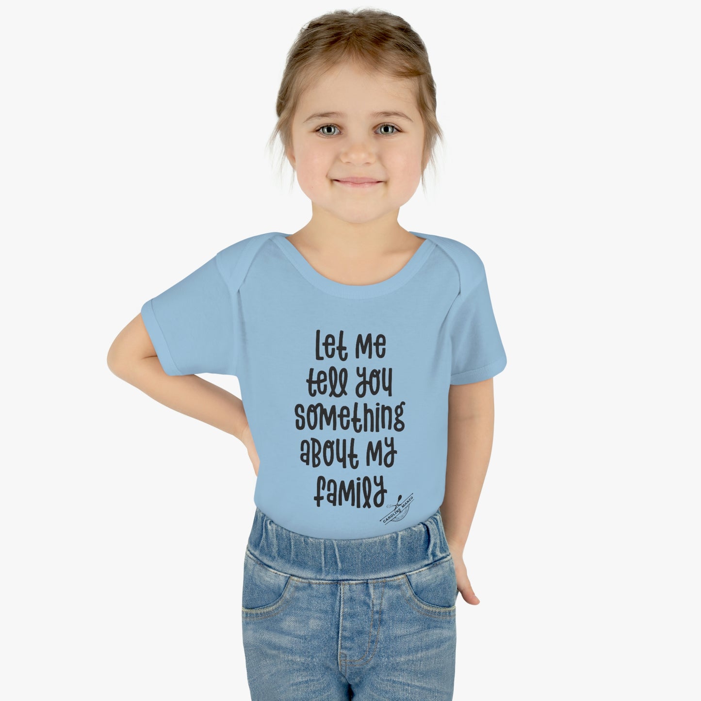 "Let me tell you something about my family" baby onesie (black lettering)