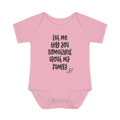 "Let me tell you something about my family" baby onesie (black lettering)