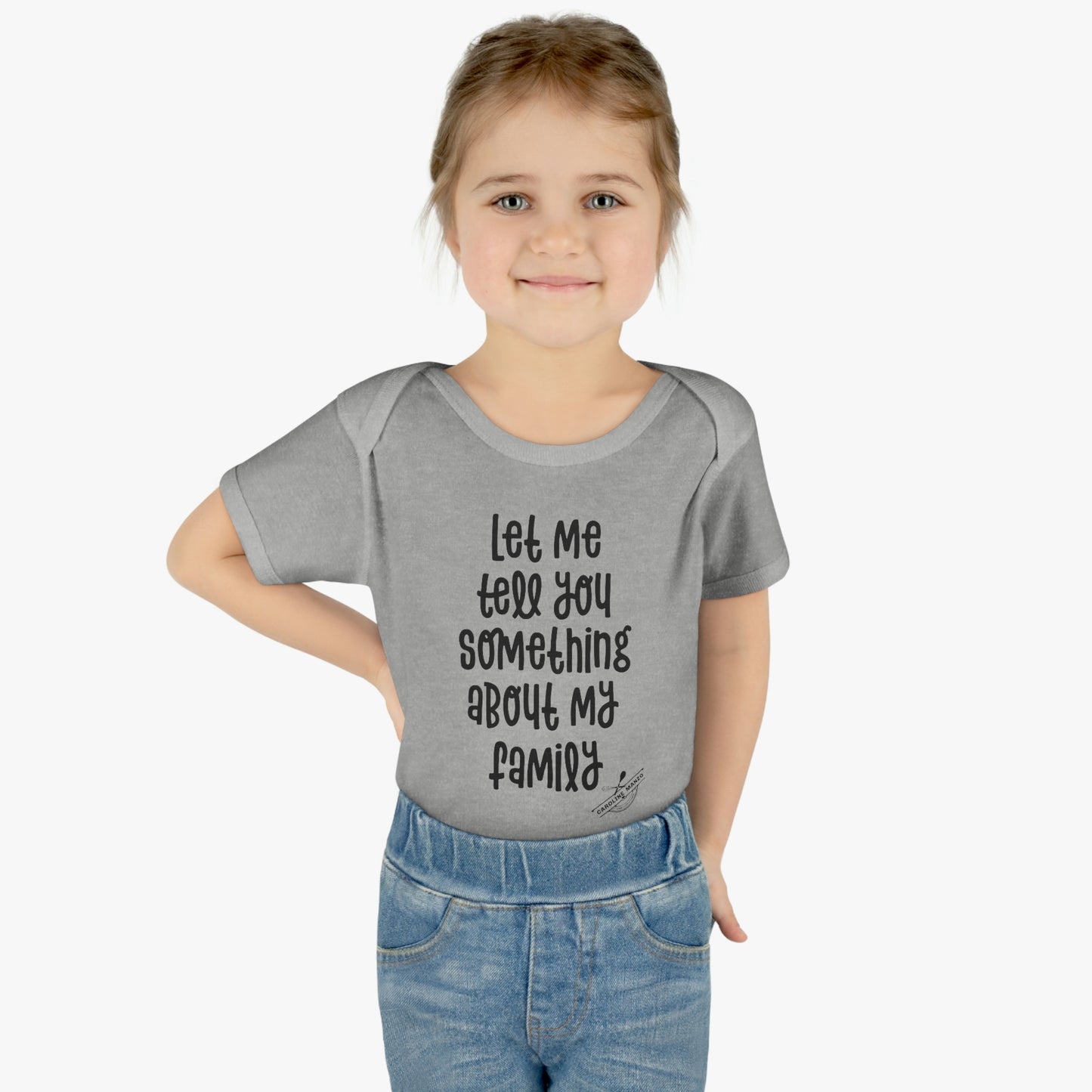 "Let me tell you something about my family" baby onesie (black lettering)