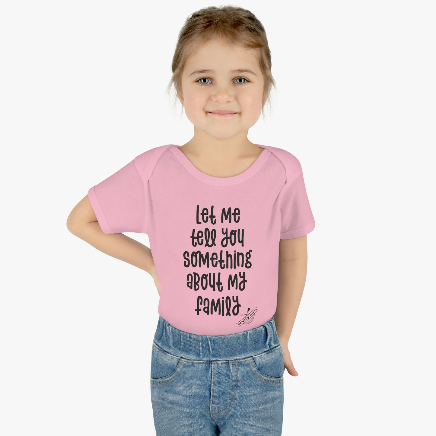 "Let me tell you something about my family" baby onesie (black lettering)